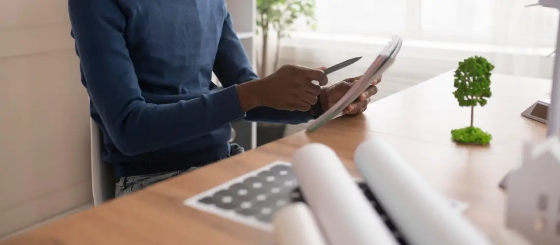 A professional property valuer assessing a home in Sydney, Australia